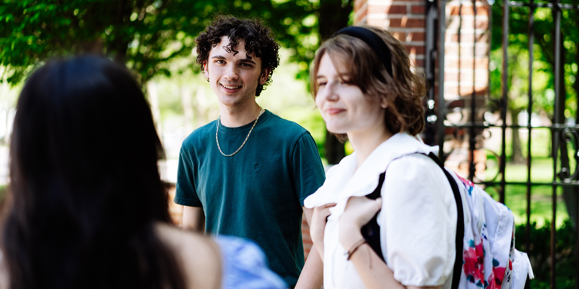 Students Standing Around Gate